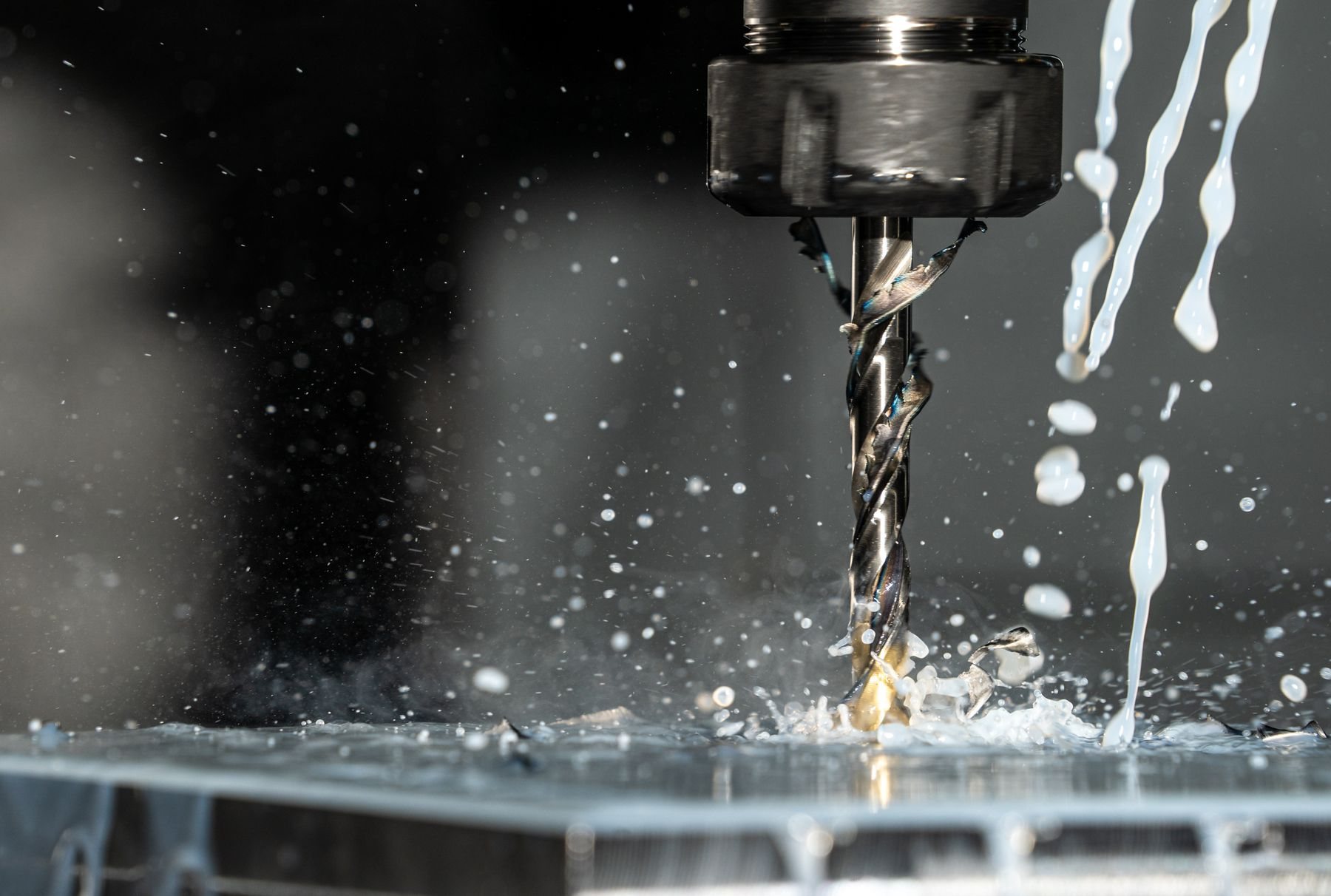 High-speed drilling with coolant on a machining centre.